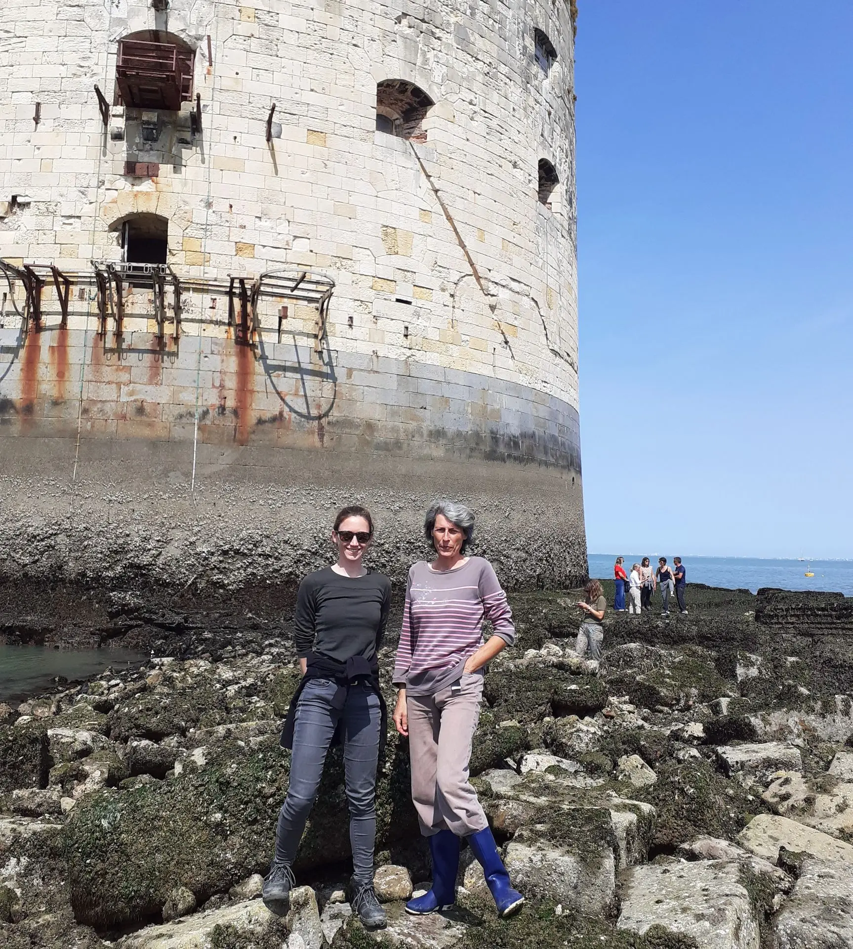 DynamOcean and Actimar during a site inspection, standing on the berm of Fort Boyard at low tide