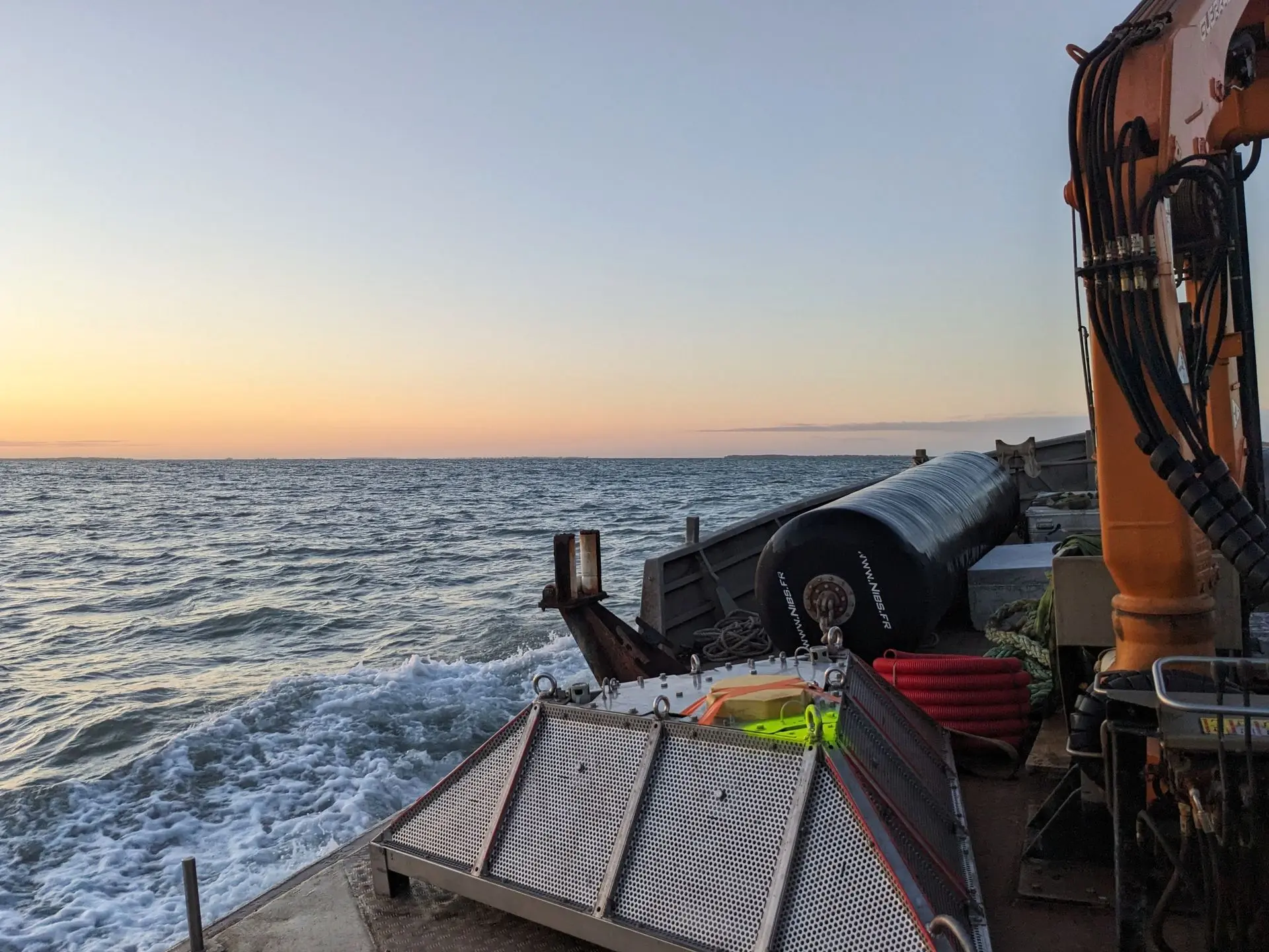 An ADCP frame on the deck of a ship at sea